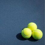 Tennis player practicing intense baseline drills – building confidence through preparation